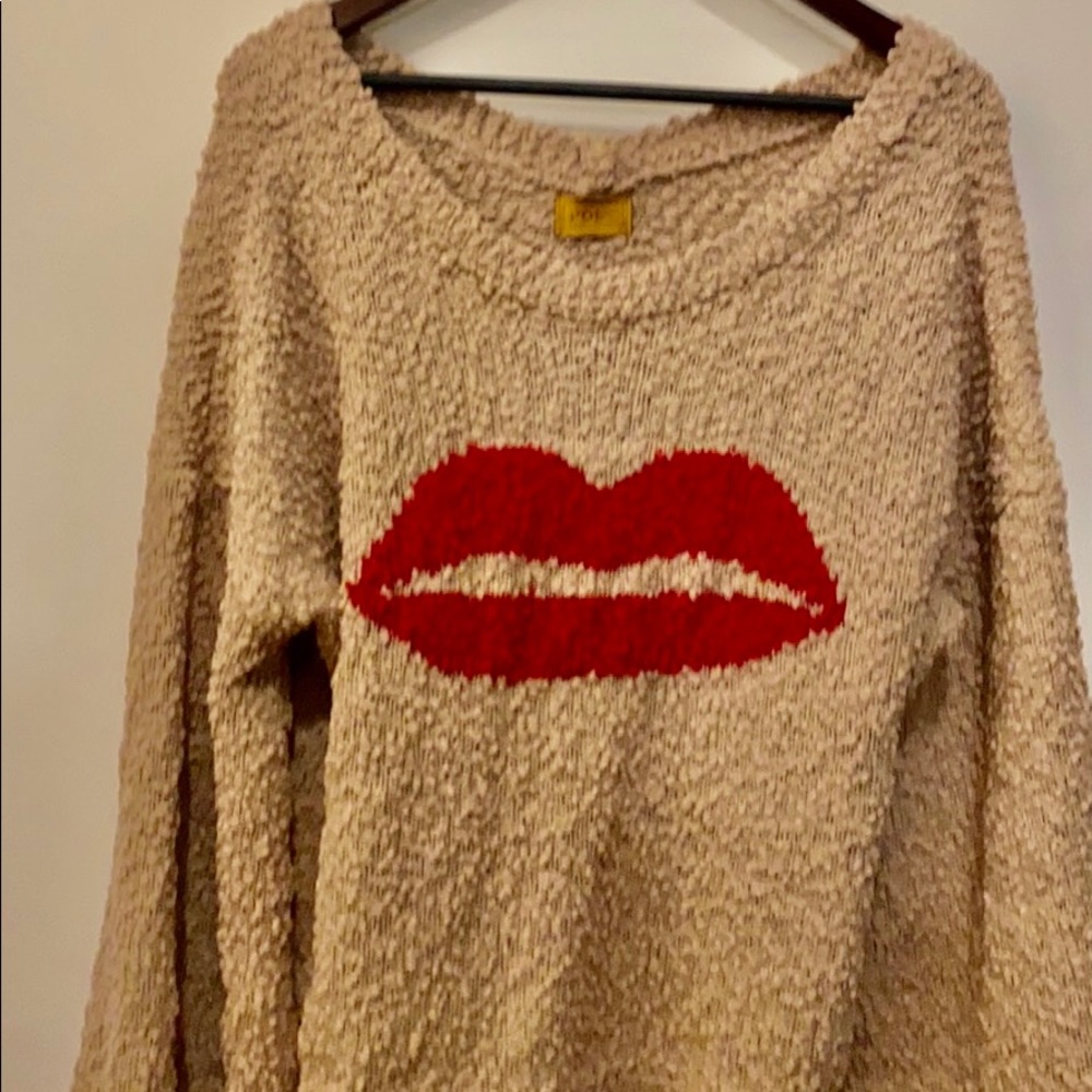 Flirty red lips on tan boat neck sweater-large